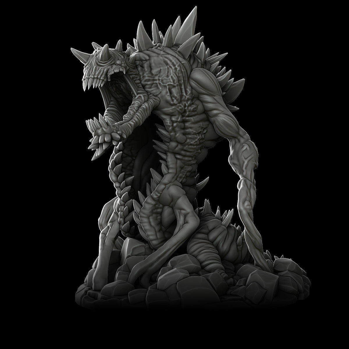 a black and white photo of a statue of a demon