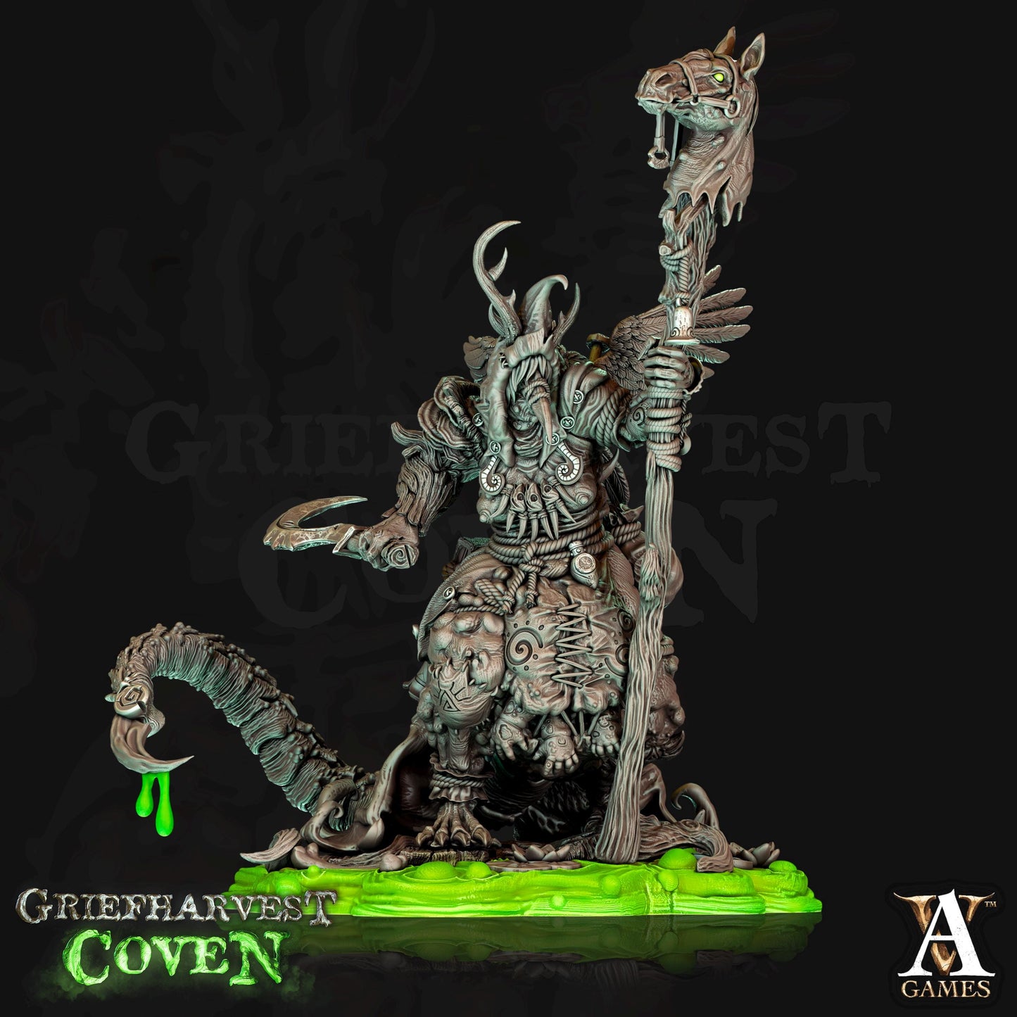 a statue of a demon holding a staff