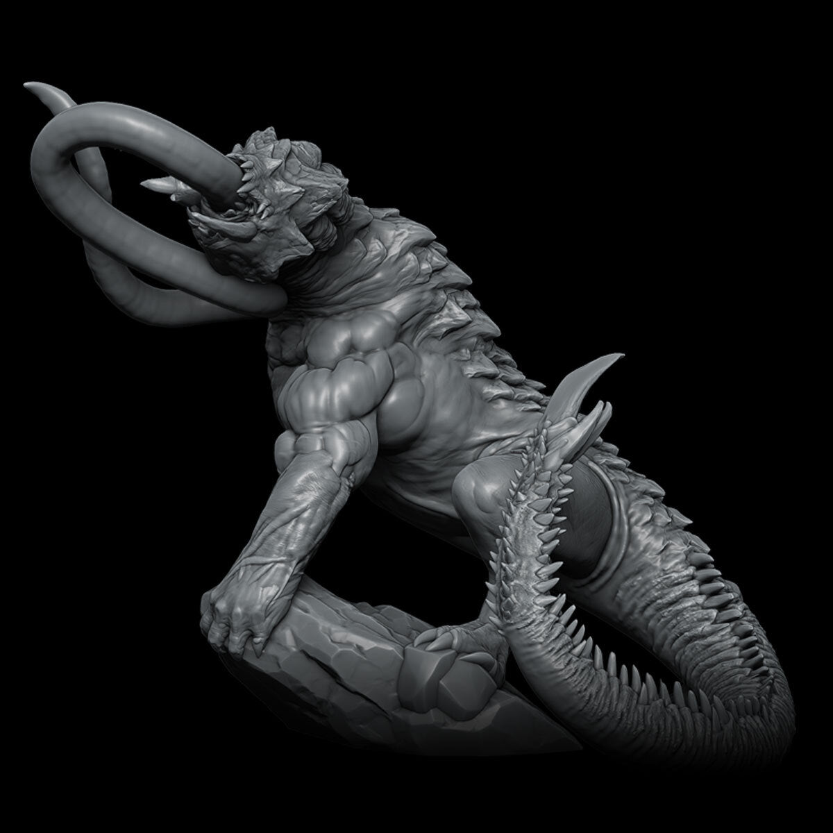a black and white photo of a statue of a demon