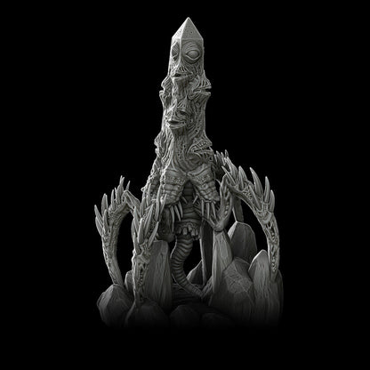 a statue of a creature sitting on top of a pile of rocks