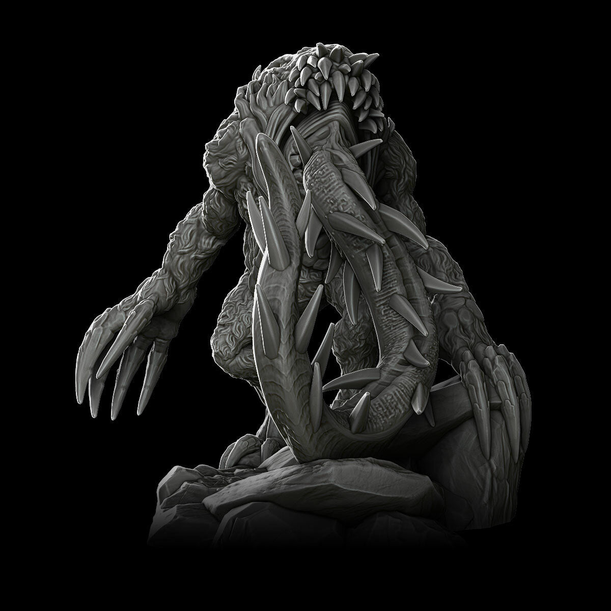 a statue of an alien sitting on a rock
