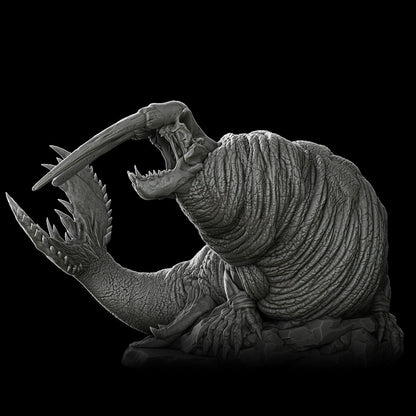 a black and white photo of a creature with its mouth open