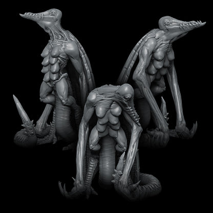 a couple of alien statues sitting next to each other