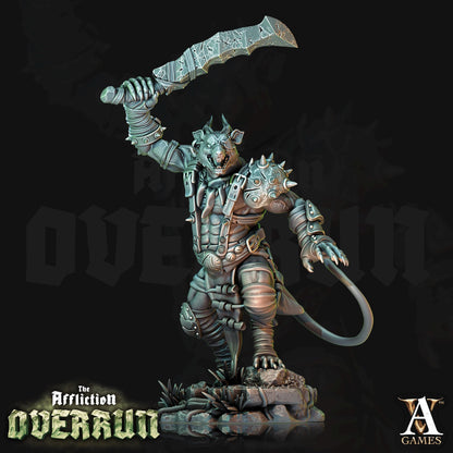a statue of a demon holding a large knife