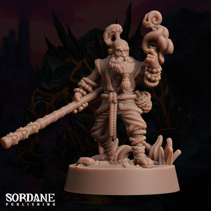 a statue of a man holding a large stick