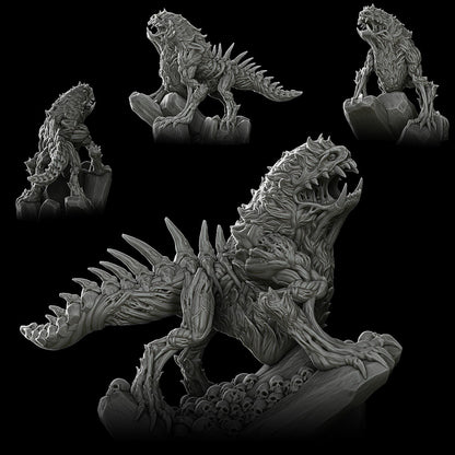 a black and white photo of godzilla figurines