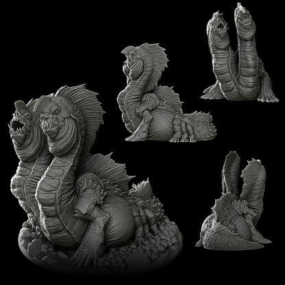 a black and white photo of a statue of a creature