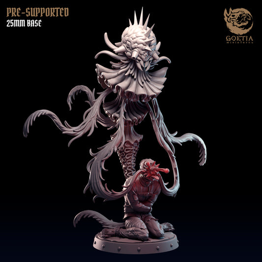 a statue of a demon with a demon head