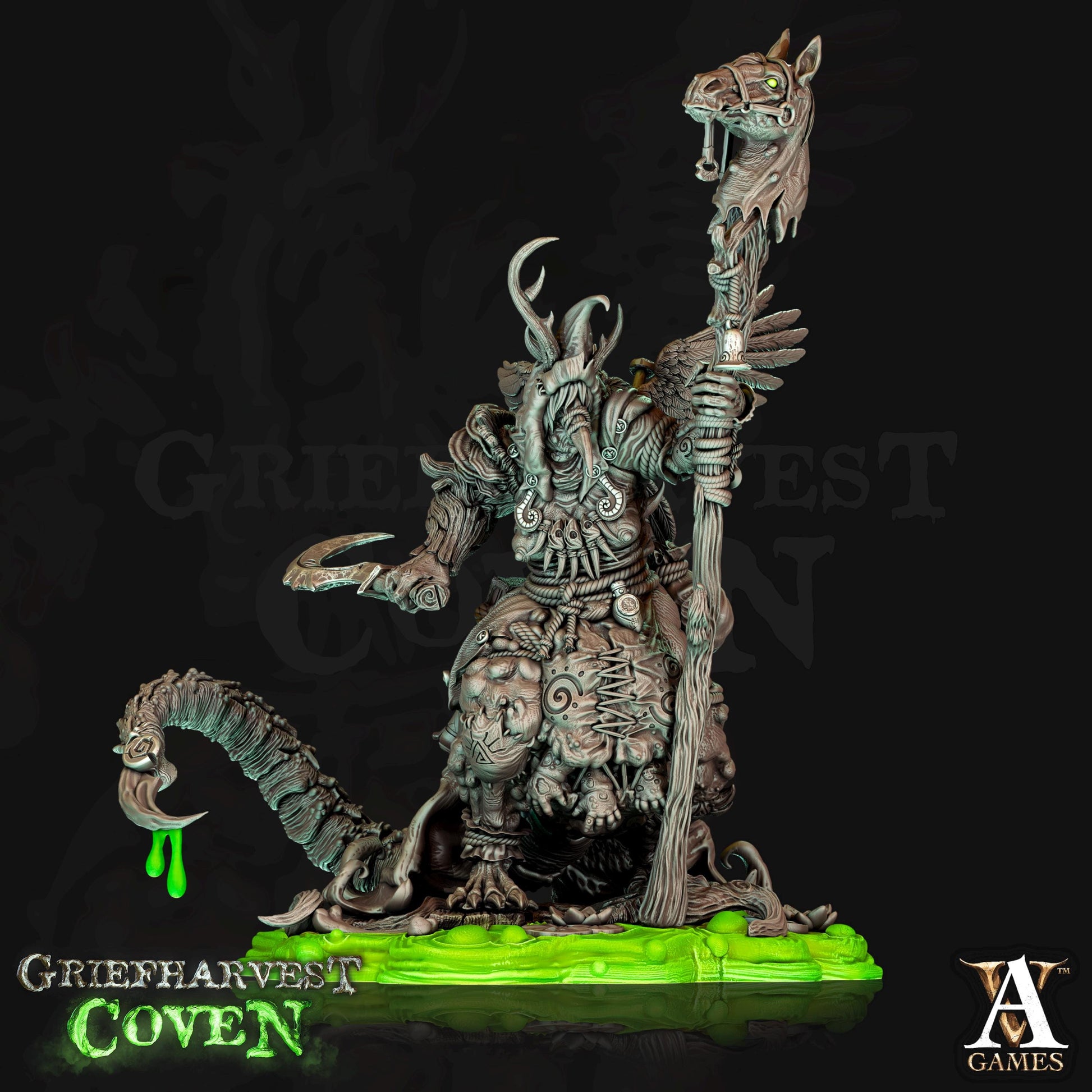 a statue of a demon holding a staff
