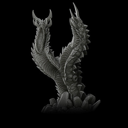a black and white photo of a dragon statue