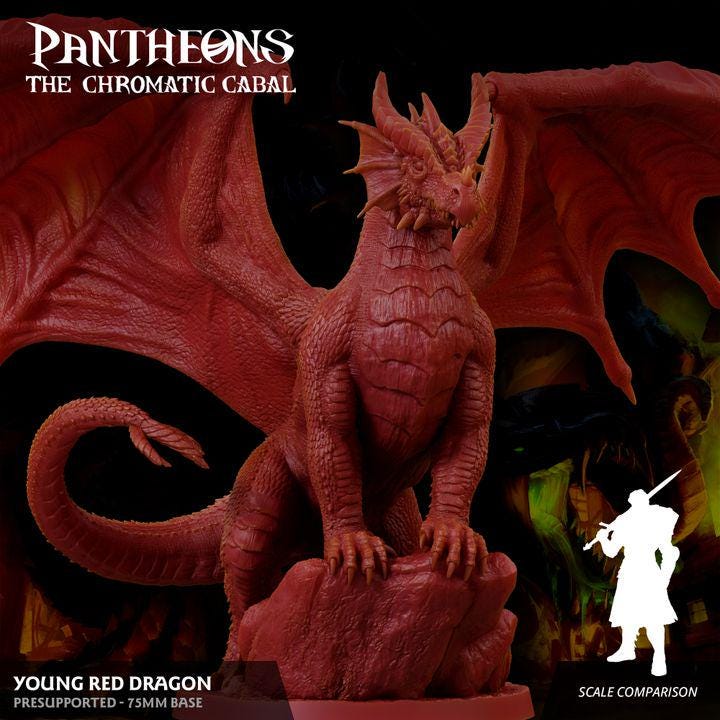 a statue of a red dragon on a rock