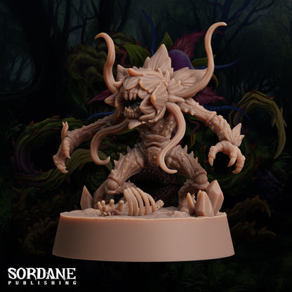a statue of a demon with large horns
