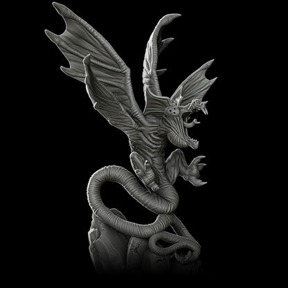 a black and white photo of a dragon statue