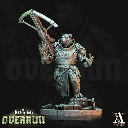 a statue of a creature holding a rifle