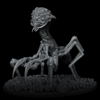 a statue of an alien sitting on top of a pile of skulls