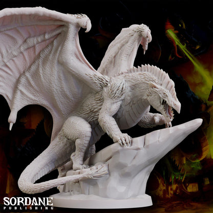 a statue of a white dragon on a rock