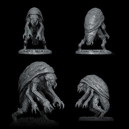 a set of three alien figurines on a black background