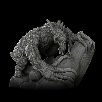 a black and white photo of a statue of a creature