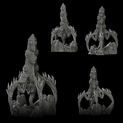 a set of four black and white figurines on a black background