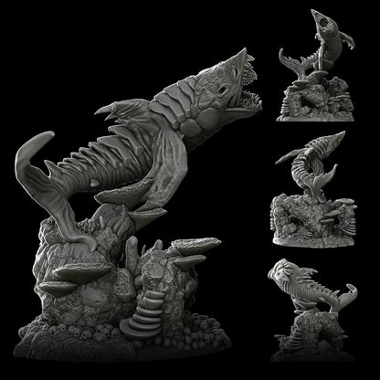 a statue of a lizard and other creatures on a black background