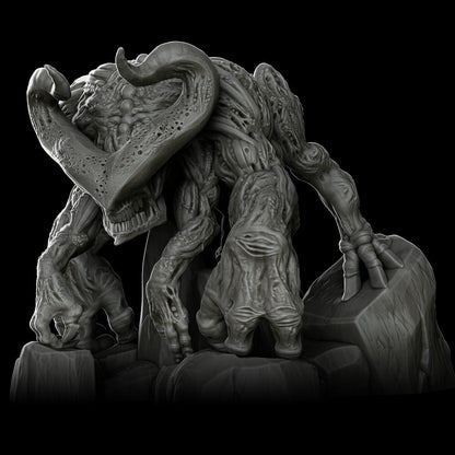 a statue of a monster with a large head