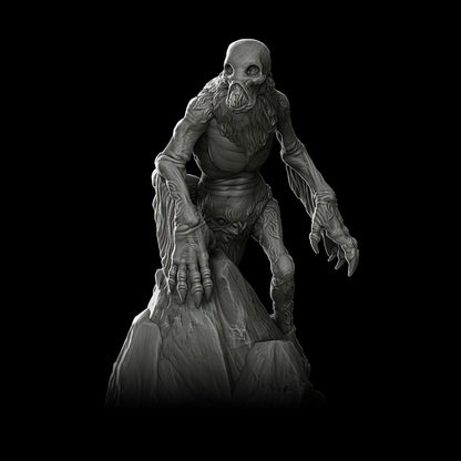 a black and white photo of a creature on a black background