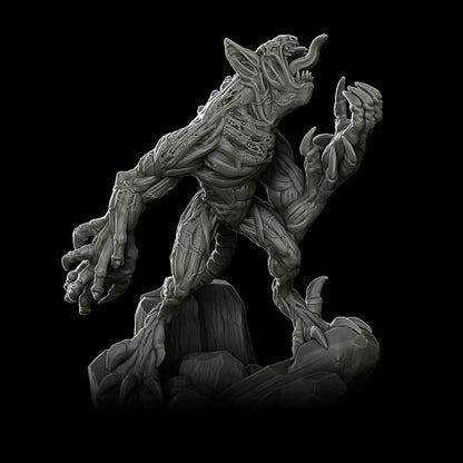 a statue of a creature on a black background