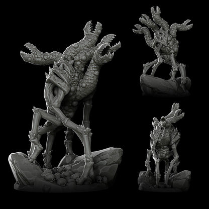 a statue of a creature on a rock