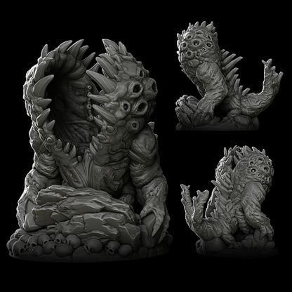 a set of three statues of monsters on a black background