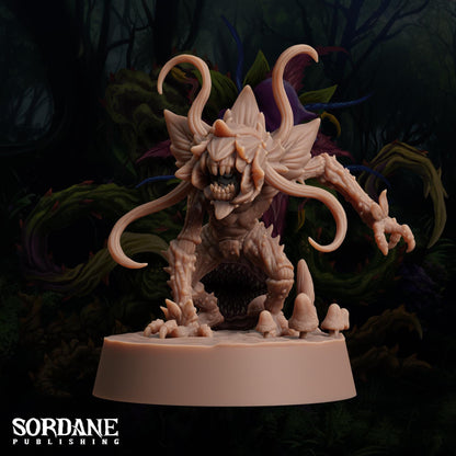 a statue of a demon with horns and claws
