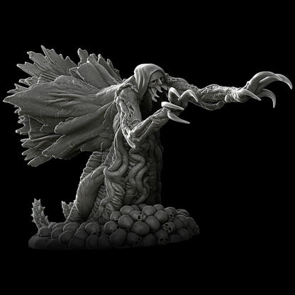 a black and white photo of a statue of a demon