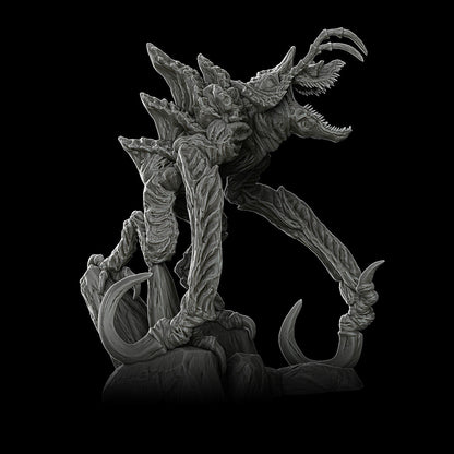 a statue of a creature with large teeth