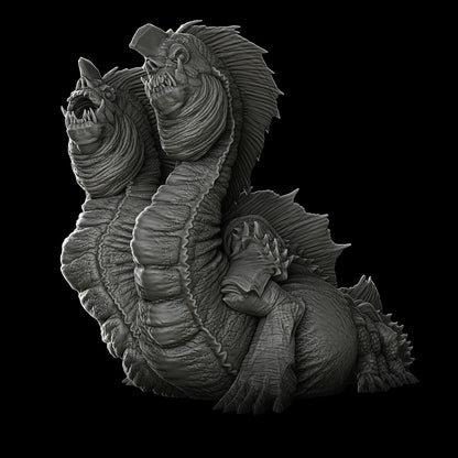 a black and white photo of a statue of a creature