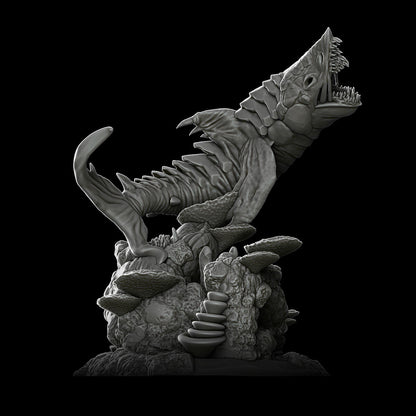 a black and white photo of a statue of a fish