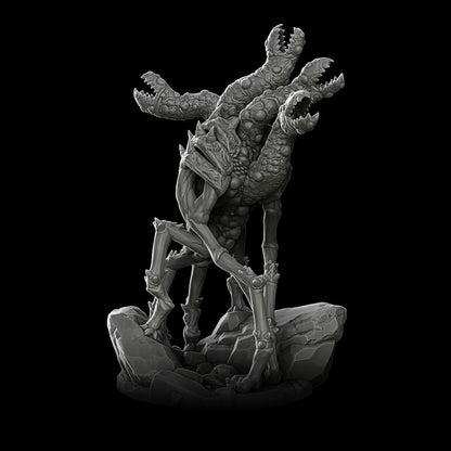 a black and white photo of a statue of a creature